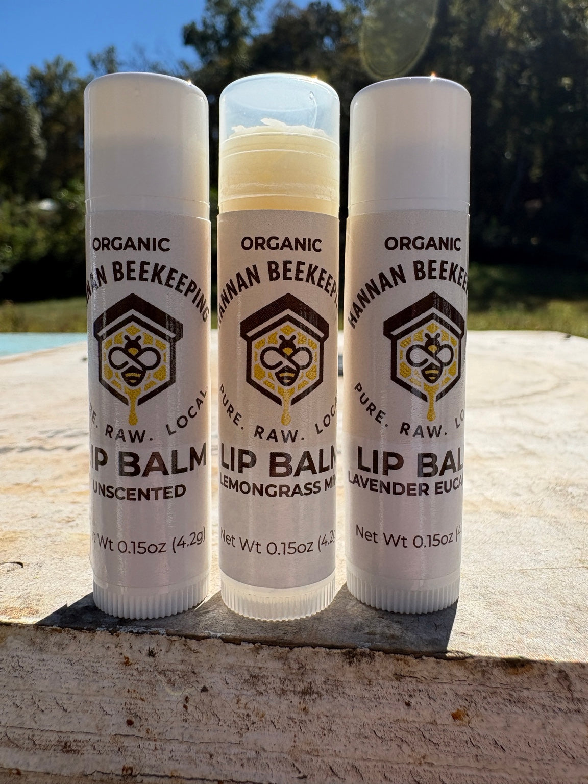 Original photograph of three Hannan Beekeeping lip balm tubes; listing is for one Lemongrass & Mint tube